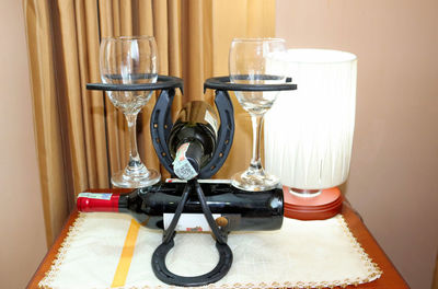 Close-up of wine glasses on table