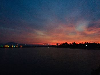 Scenic view of sea against romantic sky at sunset