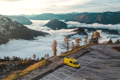 Camper van in misty morning with inversion beneth