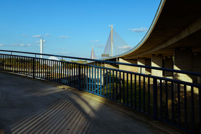 Bridge over road against sky
