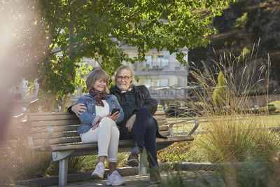 Mature couple relaxing on bench