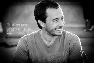 Portrait of young man smiling outdoors