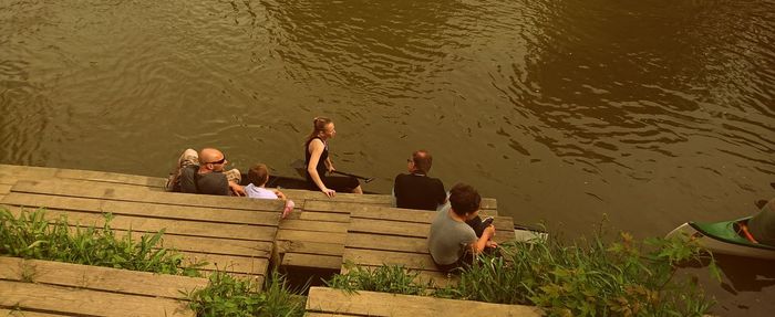 High angle view of people relaxing on water