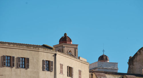 Low angle view of building against blue sky