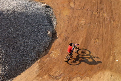 High angle view of person riding bicycle