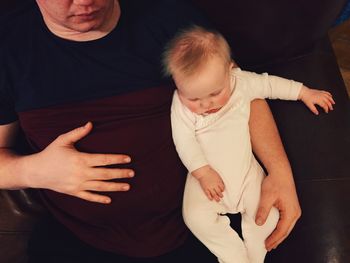 Young woman standing at home