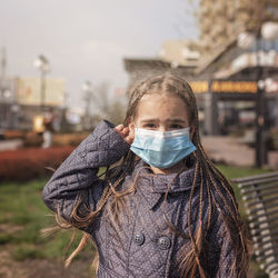 Portrait of girl standing on street