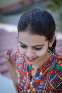 Smiling young woman looking away