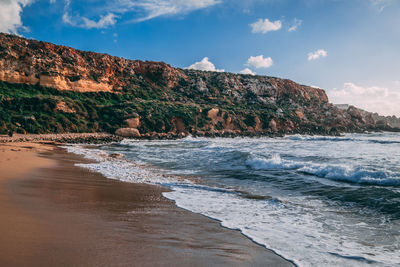 Scenic view of beach against sky