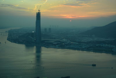 Aerial view of city at sunset