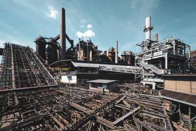 Panoramic view of factory against sky