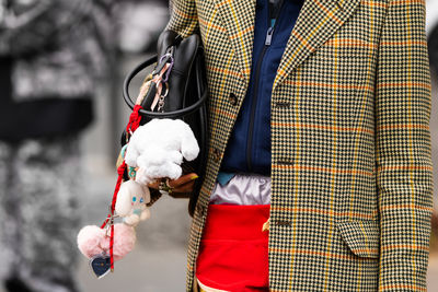 Midsection of woman holding gift