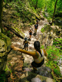 People hiking down a rocky trail