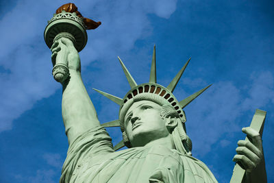 Low angle view of statue against blue sky