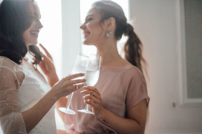 Midsection of a woman drinking glass