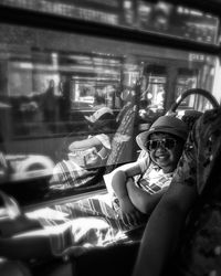 Portrait of woman sitting in train