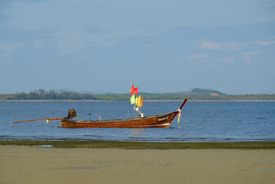 Boat on sea against sky