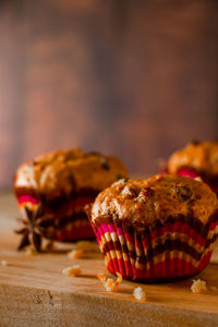 Homemade raisin cupcakes. traditional autumn pastries on a wooden background.