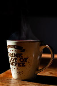 Close-up of coffee cup on table