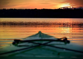 Scenic view of lake at sunset