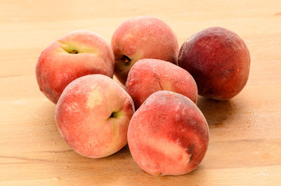 Close-up of peaches on table