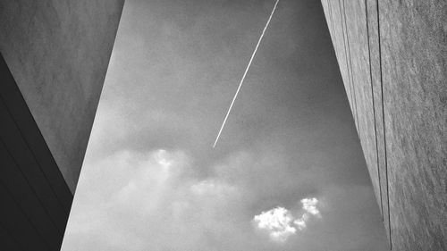 Low angle view of vapor trail against sky