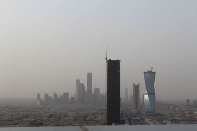 Modern buildings in city against sky