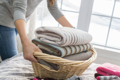 Midsection of man working in basket