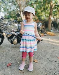 Portrait of a girl standing with a sporty outfit 