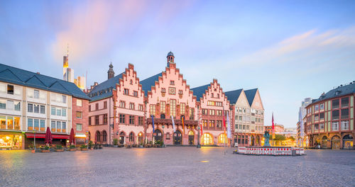 Panoramic view of buildings against sky at dusk