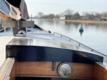 Close-up of sailboat on pier