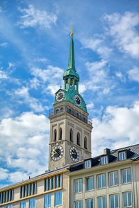 Low angle view of building against cloudy sky