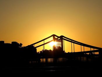 Silhouette of built structure at sunset