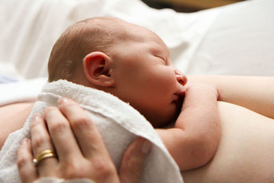 Baby girl sleeping on bed