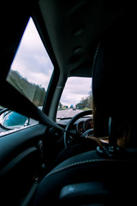 Close-up of car against sky