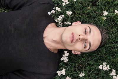 High angle view portrait of woman lying down