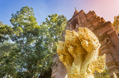 Low angle view of statue against sky