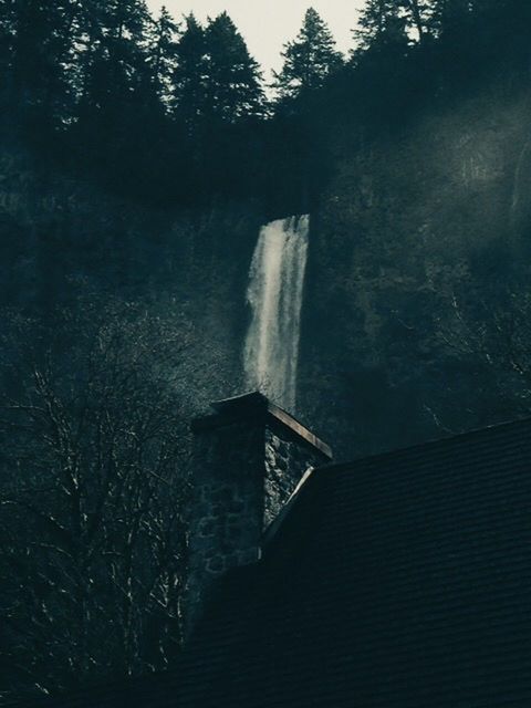 LOW ANGLE VIEW OF WATERFALL IN THE DARK
