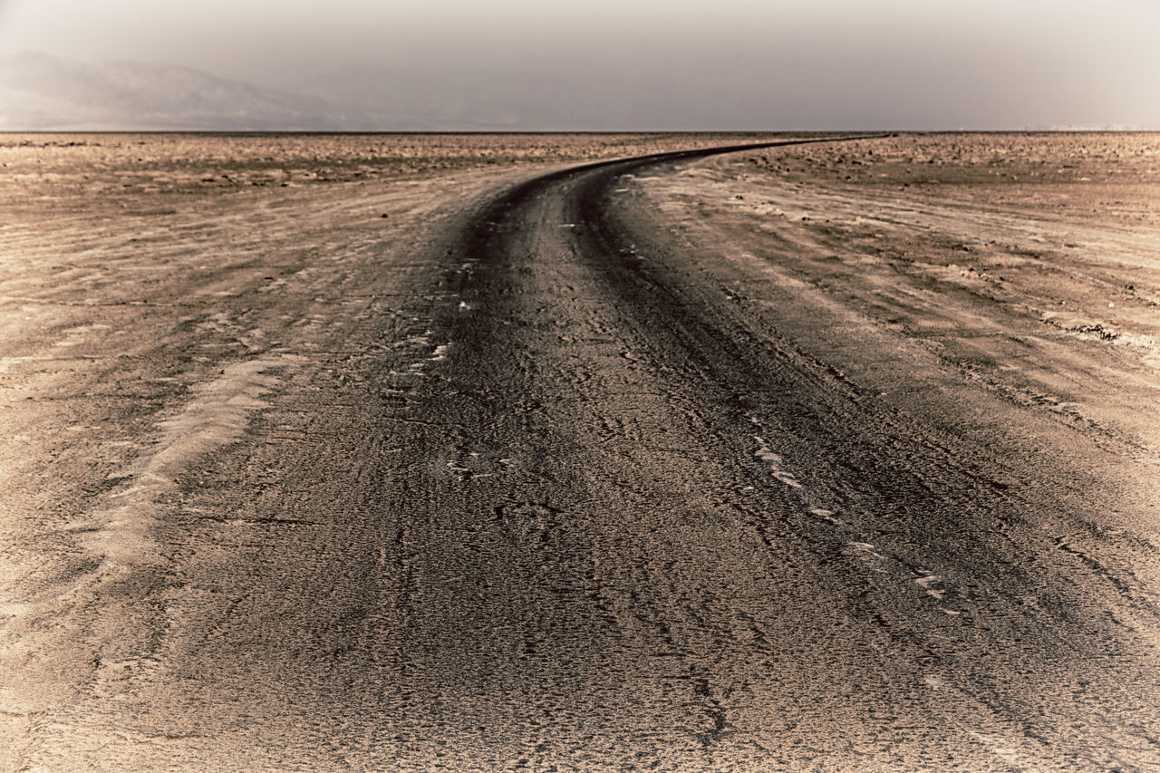 DIRT ROAD AMIDST LAND