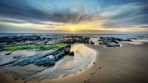 Scenic view of sea against sky during sunset
