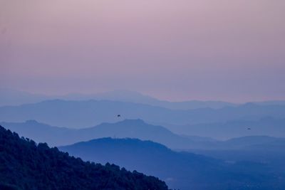 Scenic view of mountains against sky during sunset