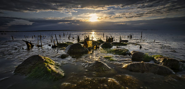 Scenic view of sea against sky during sunset