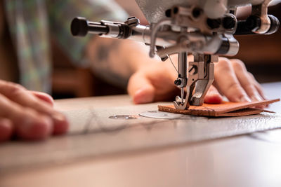 Close-up of hand holding machine