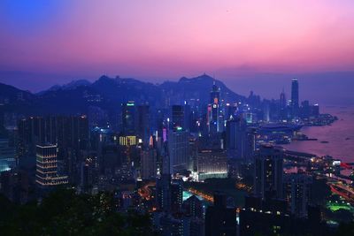 High angle view of city lit up at night