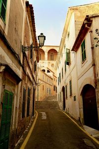 Narrow alley amidst buildings in town