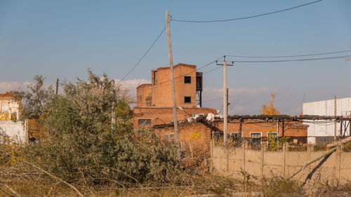 Abandoned building against clear sky