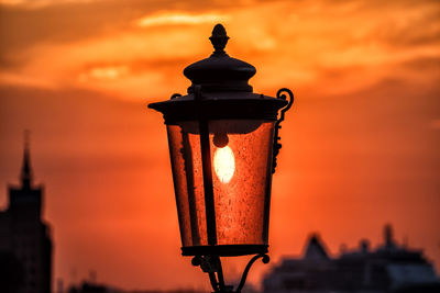 Sunset in an old street lamp