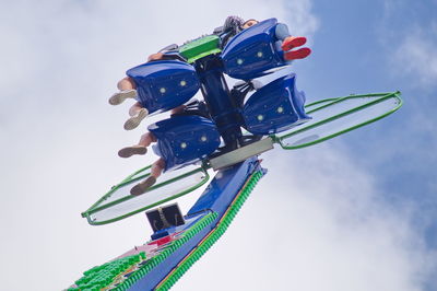 Low angle view of multi colored umbrellas against sky