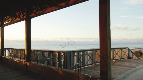 Scenic view of sea against sky at sunset