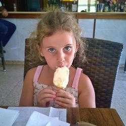 Portrait of girl eating ice cream